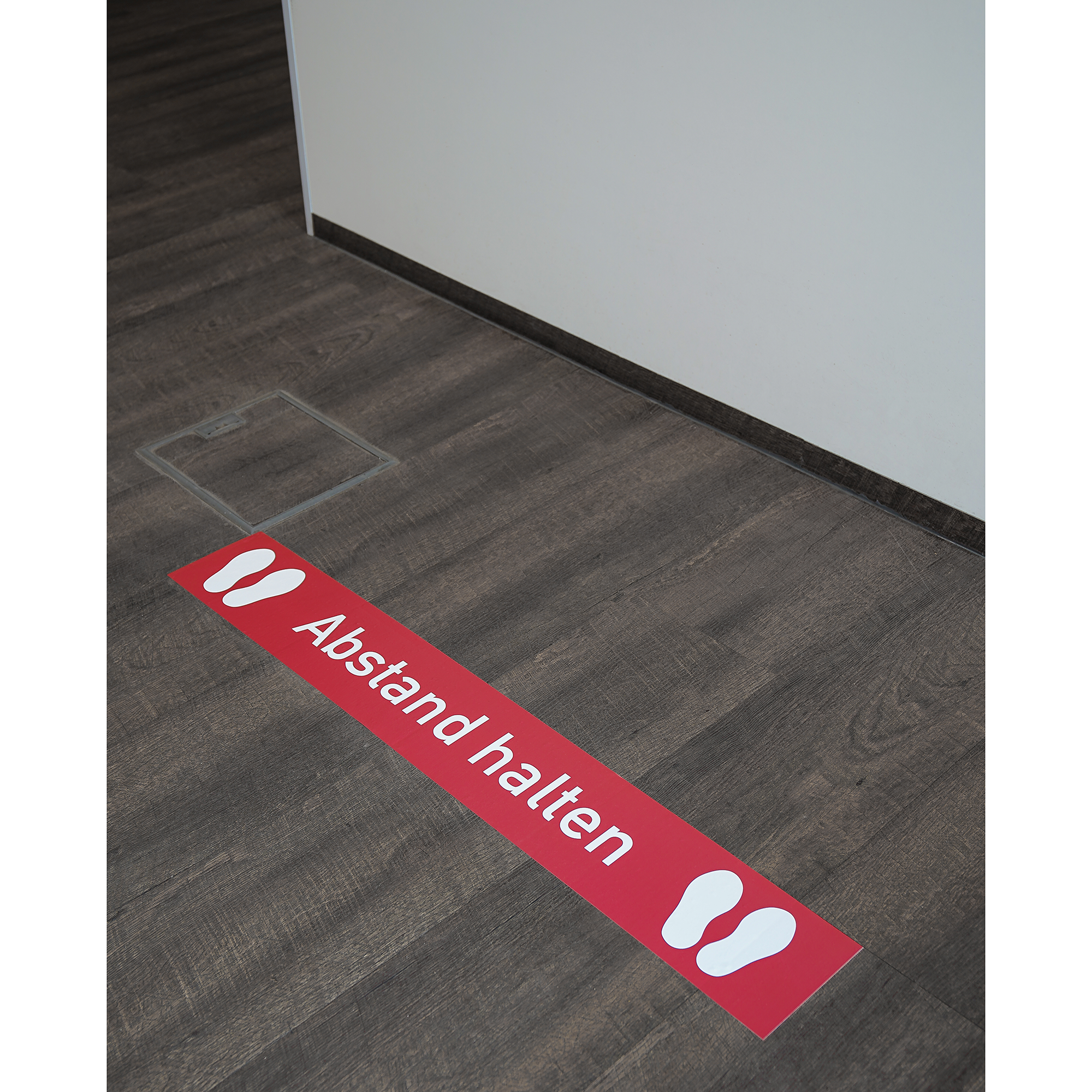 Roter Fußbodenaufkleber mit Abstand halten Aufschrift, 1000x150 mm, zum sozialen Abstand auf Böden in öffentlichen Bereichen