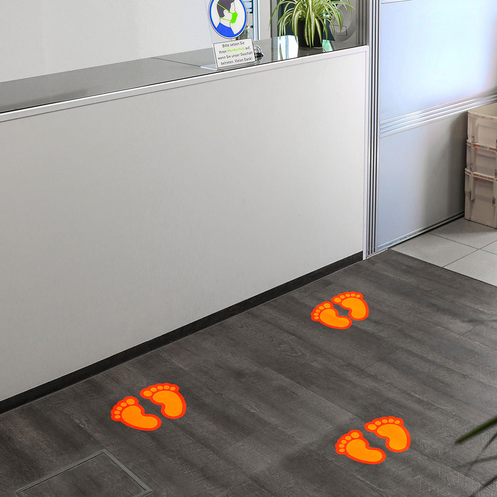 Kinderfüße Fußbodenaufkleber in Orange, Fußpaar, 170x125 mm, für kinderfreundliche Raumgestaltung, aufkleberdrucker.de